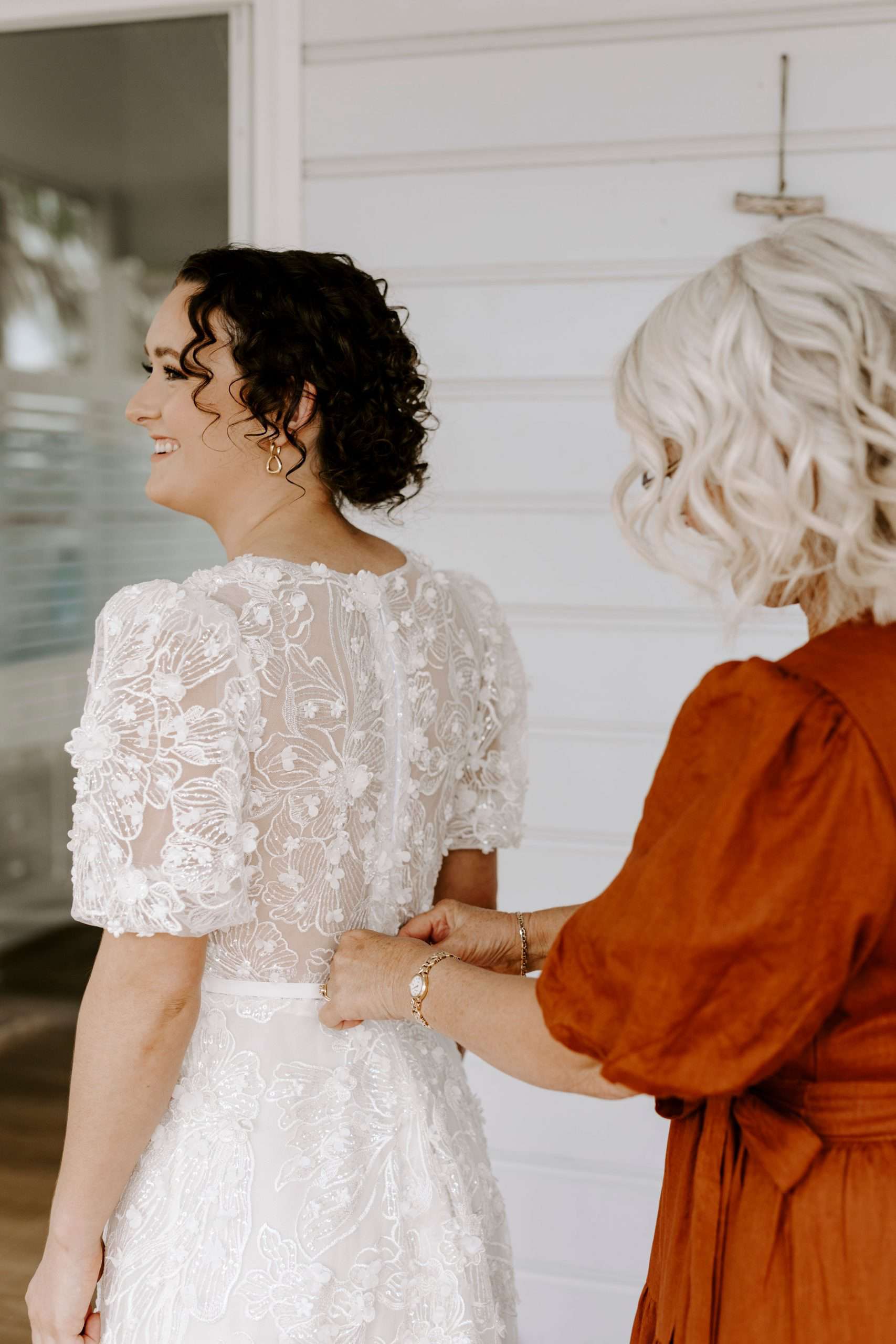 bride with natural curls in a bun